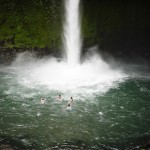 We went swimming in the pool beneath the waterfall.