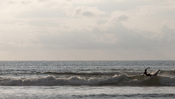 A surfer in Tamarindo, Costa Rica